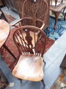 A HARLEQUIN SET OF SIX FRUITWOOD AND ELM WHEELBACK WINDSOR CHAIRS WITH CRINOLINE STRETCHERS.