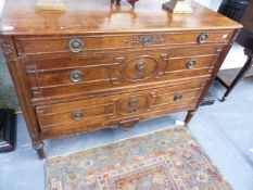 A 19TH.C.CONTINENTAL OAK THREE DRAWER CHEST WITH CARVED AND MOULDED DECORATION.