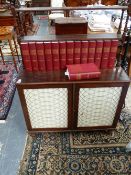 A REGENCY MAHOGANY CHIFFONIER WITH RAISED OPEN SHELF BACK OVER TWO DOORS AND BRASS LATTICE AND