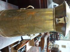 A VINTAGE TAPERED FORM POLISHED BRASS TWIN HANDLED MILK CHURN INSCRIBED GUARANTEED PURE MILK,