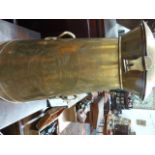 A VINTAGE TAPERED FORM POLISHED BRASS TWIN HANDLED MILK CHURN INSCRIBED GUARANTEED PURE MILK,