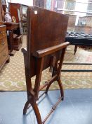 AN EDWARDIAN OAK FOLDING COACHING TABLE. STAMPED HOWARD & SONS.