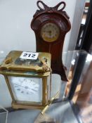 AN ART NOUVEAU CASED DRESSING TABLE CLOCK TOGETHER WITH A FRENCH BRASS CARRIAGE CLOCK