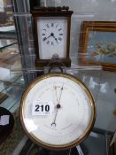 A BRASS CASED HOLESTRIC ANEROID BAROMETER TOGETHER WITH A SMALL BRASS CARRIAGE CLOCK