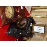 A VICTORIAN BLACK SLATE MANTLE CLOCK, A CARRIAGE CLOCK AND AN EDWARDIAN INLAID DESK CLOCK.