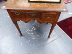 AN 18TH.C.OAK LOW BOY WITH THREE DRAWERS ON TURNED LEGS.
