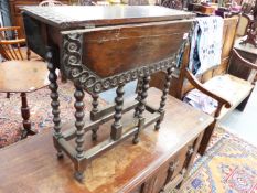 A 19TH.C.CARVED OAK SMALL OCCASIONAL TABLE ON BOBBIN SUPPORTS AND TWO OTHERS.
