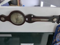 A LATE GEORGIAN MAHOGANY AND BOXWOOD STRUNG FOUR DIAL BANJO BAROMETER.