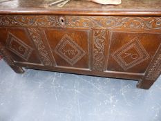 A 17TH/18TH.C.OAK PANEL FRONT COFFER WITH CARVED DATE OF 1670.
