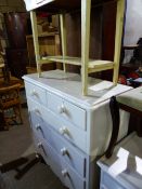 A LARGE VICTORIAN PAINTED PINE CHEST OF DRAWERS AND A PAINTED SIDE TABLE