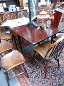 A GEO.III.MAHOGANY EIGHT LEG DROP LEAF DINING TABLE ON TURNED TAPER LEGS WITH CLUB FEET.