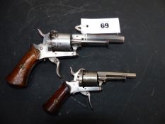 TWO CONTINENTAL PINFIRE REVOLVERS, EACH WITH SIX-SHOT CYLINDER, FOLDING TRIGGER AND TWO PIECE WOODEN