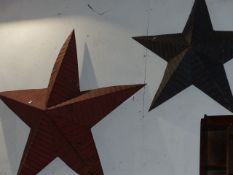 TWO LARGE PAINTED METAL WALL HANGING FIVE POINT STARS.