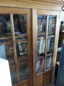 A GLAZED PINE BOOKCASE