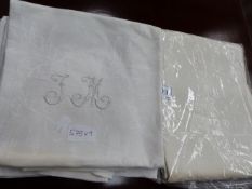 A DAMASK LINEN TABLECLOTH. 200x200cms, MONOGRAMNED RD TOGETHER WITH NINE DAMASK NAPKINS