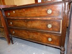 A 19TH.C.MAHOGANY CHEST OF THREE LONG DRAWERS FLANKED BY CARVED AND REEDED COLUMN SUPPORTS.