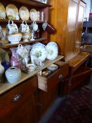 A SMALL PINE DRESSER WITH PLATE RACK, A SIMILAR PINE KITCHEN TABLE AND A TWO DOOR CUPBOARD