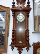 A VICTORIAN TWIN WEIGHT VIENNA WALL CLOCK.