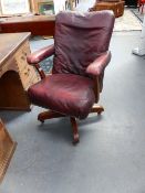 AN EARLY 20TH.C.LEATHER UPHOLSTERED SWIVEL OFFICE CHAIR