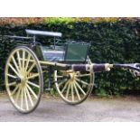 AN EARLY 20TH.C.COUNTRY CART IN RESTORED AND REPAINTED YELLOW LIVERY.