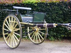 AN EARLY 20TH.C.COUNTRY CART IN RESTORED AND REPAINTED YELLOW LIVERY.