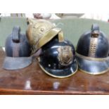 FOUR VINTAGE FIREMAN'S HELMETS