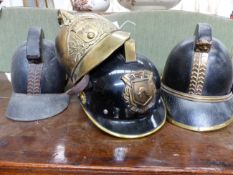 FOUR VINTAGE FIREMAN'S HELMETS