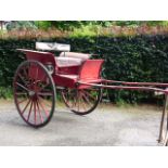 AN EARLY 20TH.C.COUNTRY CART IN RED LIVERY, FOR RESTORATION.