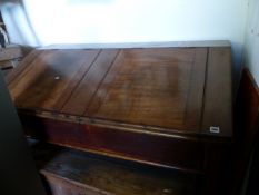 AN ANTIQUE MAHOGANY AND PINE DOUBLE CLERK'S DESK