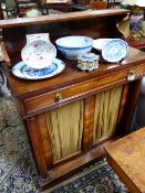 A LATE REGENCY ROSEWOOD CHIFFONIER WITH RAISED SHELF BACK OVER FRIEZE DRAWER AND PANEL DOORS FLANKED