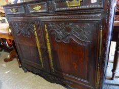 A 19TH.C.FRENCH OAK SIDE CABINET WITH TWO FRIEZE DRAWERS AND CARVED PANEL DOORS BELOW