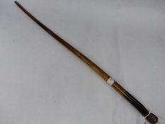 A STOUT RHINO HORN SWAGGER STICK WITH WHITE METAL MOUNTS AND EBONY HANDLE, DATED W D 1894
