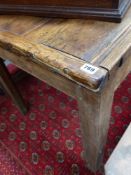 A COUNTRY MADE OAK KITCHEN PREP TABLE WITH PLANK TOP AND STOUT SQUARE CHAMFERRED LEGS.