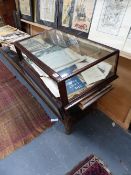 AN ANTIQUE GLAZED COUNTER TOP DISPLAY CABINET.