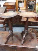 A PAIR OF INDIAN CARVED HARDWOOD STANDS WITH TRIFID SUPPORTS AND BRASS FOLIATE INLAY TO TOPS. H.