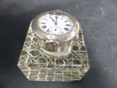 A SILVER MOUNTED SQUARE GLASS INKWELL WITH FOLDING DESK CLOCK, LONDON 1907. 7.5CM