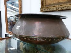 AN UNUSUAL SGALLOW COPPER JARDINIERE OF RIVETTED CONSTRUCTION. D.54cms