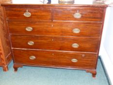 A LATE GEORGIAN MAHOGANY CHEST OF TWO SHORT AND THREE LONG DRAWERS ON SHAPED SWEPT BRACKET FEET.