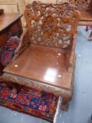 A SIMILAR PAIR OF CHINESE EXPORT CARVED HARDWOOD ARMCHAIRS, PIERCED DRAGON DECORATION WITH FIGURAL