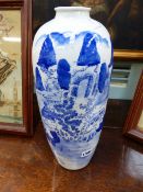 A JAPANESE BLUE AND WHITE TALL VASE WITH LANDSCAPE DECORATION, EXTENSIVELY INSCRIBED ON REVERSE.