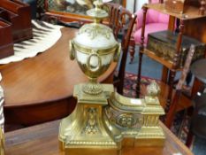 A PAIR OF FRENCH NEO CLASSICAL STYLE POLISHED BRASS CHENETS WITH MARBLE FINIALS.