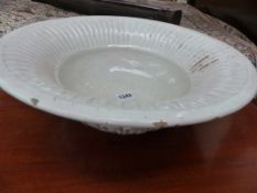 A CONTINENTAL FAIENCE BASIN WITH FLUTED RIM, CREAM GLAZE. D.36cms.