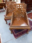 A PAIR OF CHINESE EXPORT CARVED HARDWOOD ARMCHAIRS, PIERCED DRAGON DECORATION WITH FIGURAL BACK