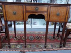 AN ANTIQUE MAHOGANY AND BURR WOOD CROSS BANDED AND INLAID SERPENTINE FRONT SIDEBOARD WITH IRISH