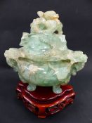 A CHINESE CARVED GREEN QUARTZ COVERED CENSER WITH DRAGON FINIAL AND HANDLES AND CONFORMING