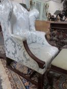 A 19TH.C.WING BACK ARMCHAIR WITH MAHOGANY SHOW FRAME ON SQAURE CHAMFERRED LEGS.