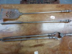 A SET OF THREE VICTORIAN STEEL FIRE TOOLS.