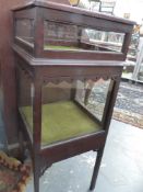 A MAHOGANY BIJOUTERIE CABINET.