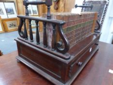 A REGENCY STYLE LYRE END BOOK CARRIER WITH DRAWER TO BASE.