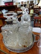 FOUR CUT GLASS LIQUOR DECANTERS, TWO WITH HALLMARKED SILVER COLLARS AND FOUR SILVER LABELS AND A